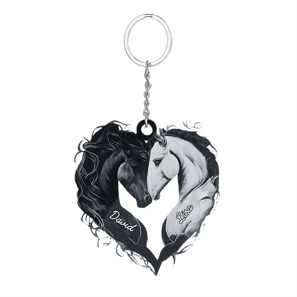 Black and white acrylic heart-shaped keychain featuring two horses touching heads with customizable names on each side.