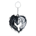Black and white acrylic heart-shaped keychain featuring two horses touching heads with customizable names on each side.