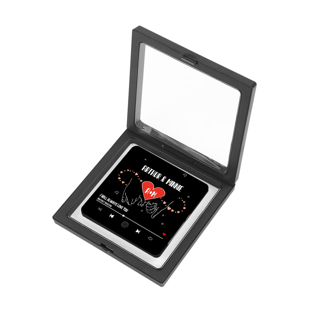 Open black display box featuring personalized music plaque with song title and couple's names.